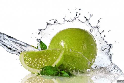 Water splash on lime with mint isolated on white