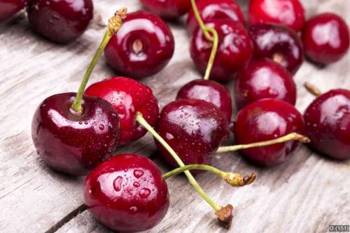 Cherries on wooden table