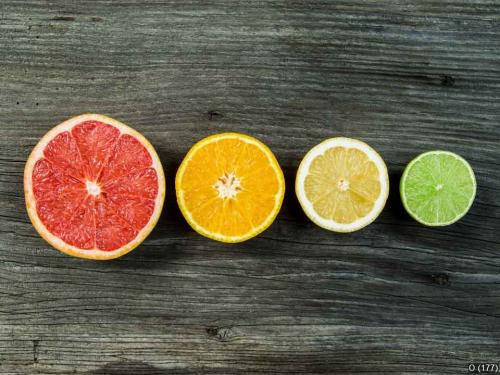 Fruit on wood background in a row