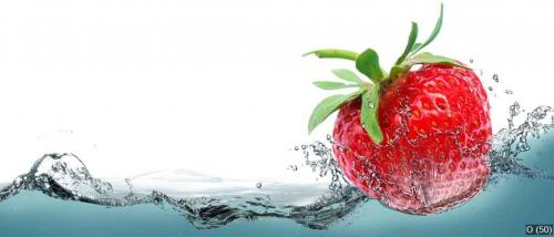 Juicy strawberry on a background of splashing water.