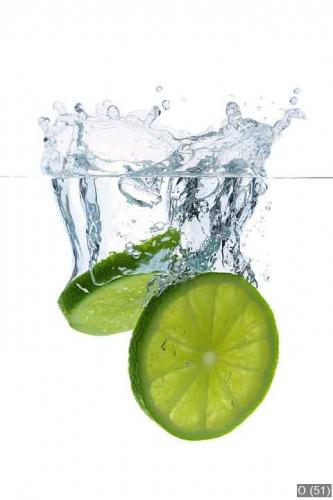 Falling lime slices with water splashes