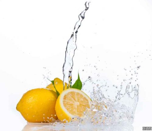 Fresh lemons with water splash, isolated on white background