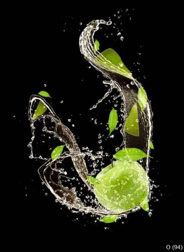 Fresh apples falling in water splash, on black background