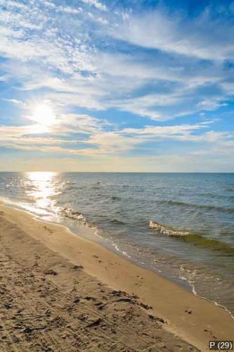 Sun over beautiful sea and beach in Debki village, Baltic Sea, P