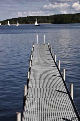 footbridge reaches into a lake